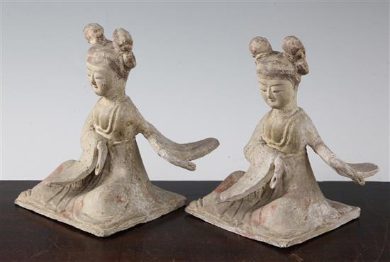 Two Chinese pottery seated figures of ladies, probably Tang dynasty, height 18cm, repairs